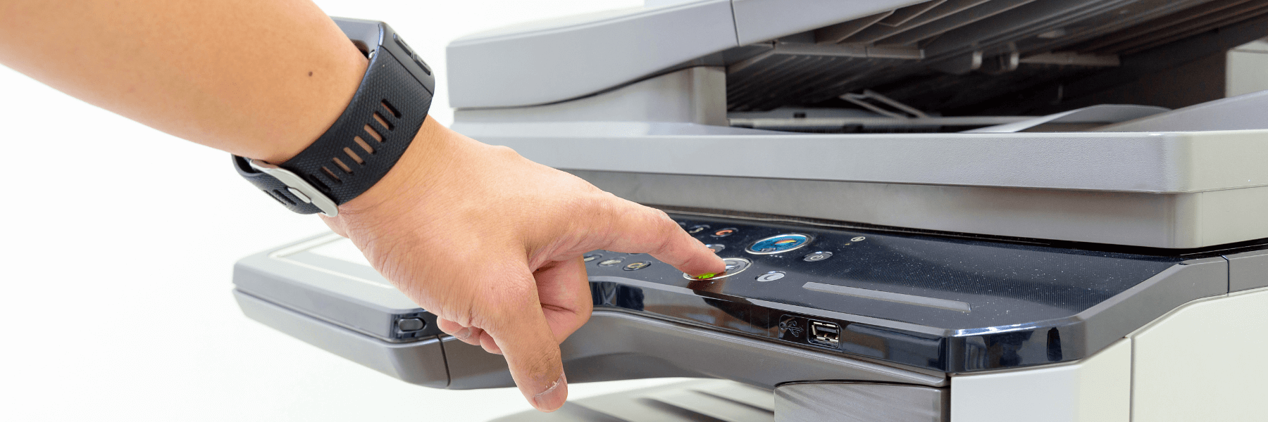 man using multifunction printer