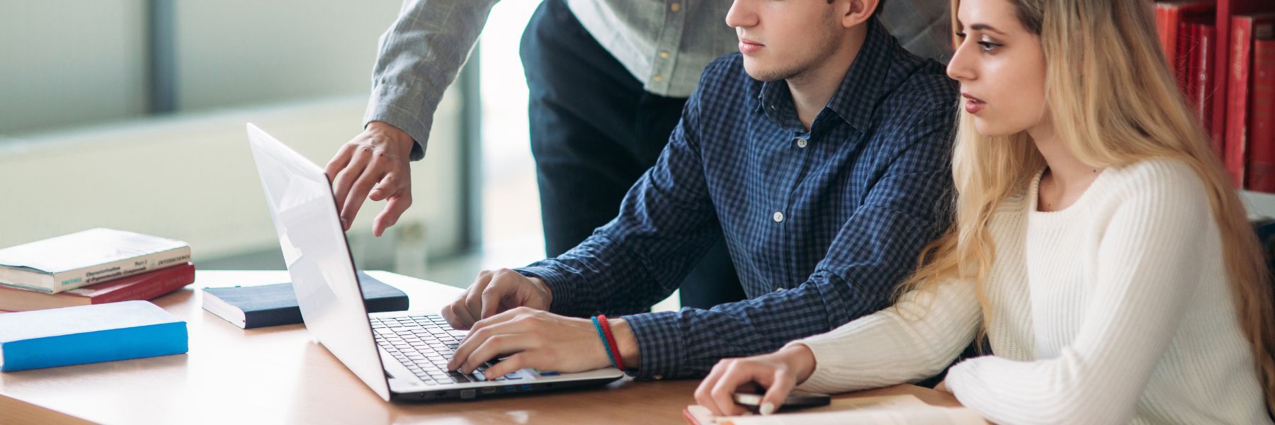 students looking at computer