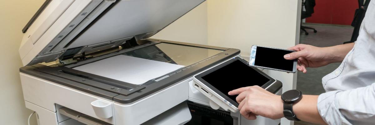 man at printer being secure